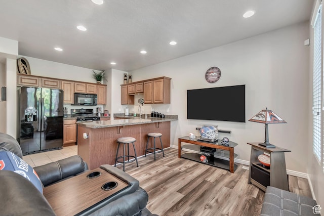 5436 W Brentford Ct, West Valley City, UT 84120 - living room featuring recessed lighting and light wood-type flooring