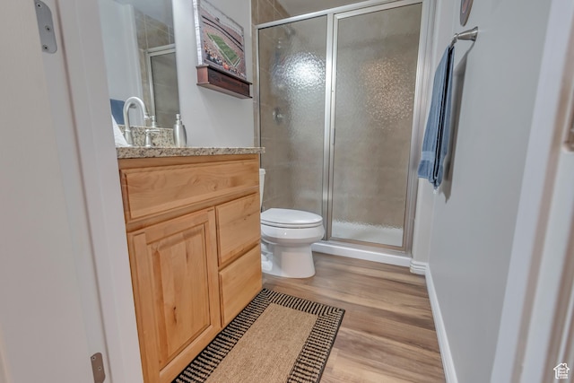 5436 W Brentford Ct, West Valley City, UT 84120 - bathroom featuring vanity, wood finished floors, and a shower stall