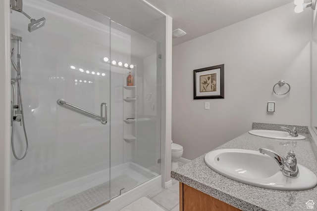 5436 W Brentford Ct, West Valley City, UT 84120 - bathroom featuring a shower stall, double vanity, and tile patterned floors