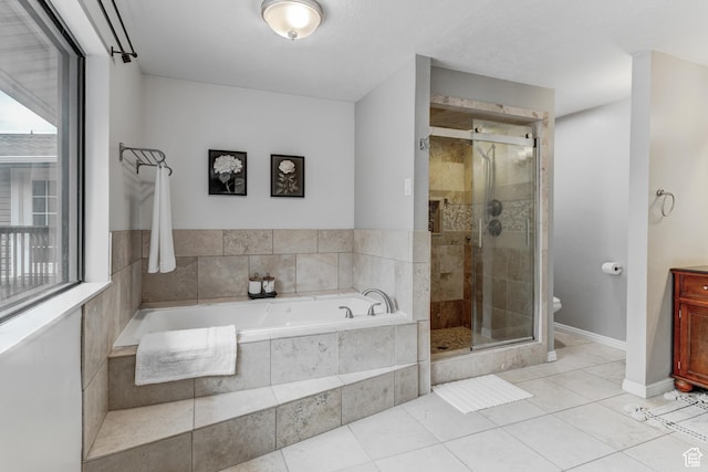 4831 E Emigration Canyon Rd, Salt Lake City, UT 84108 - bathroom featuring a bath, a shower stall, tile patterned flooring, and vanity
