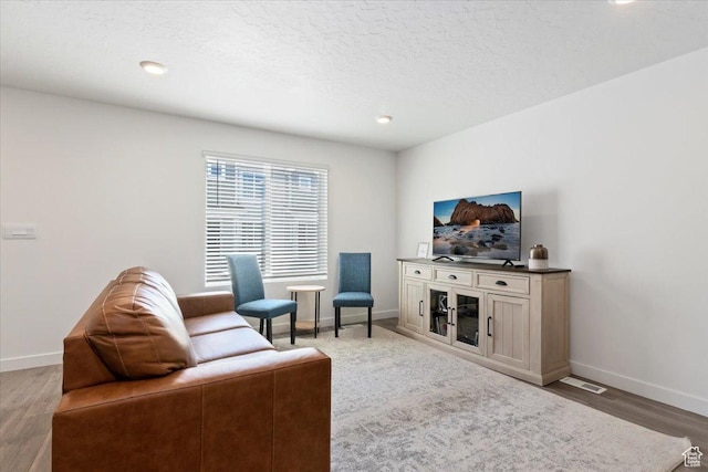661 W 1920 S Unit 1070, Provo, UT 84601 - living room featuring light wood-style floors, recessed lighting, and a textured ceiling