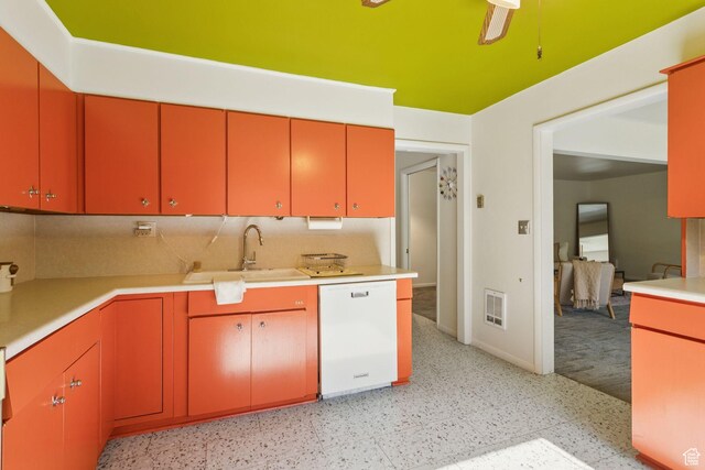 1112 E 2700 S Unit C17, Salt Lake City, UT 84106 - kitchen with white dishwasher, light countertops, red cabinetry, and light flooring