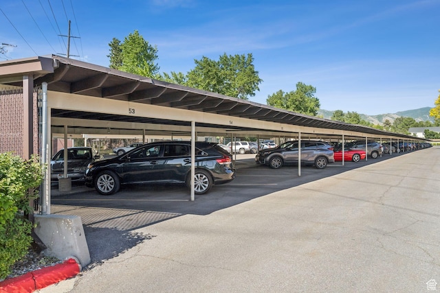 1112 E 2700 S Unit C17, Salt Lake City, UT 84106 - covered parking lot featuring a mountain view