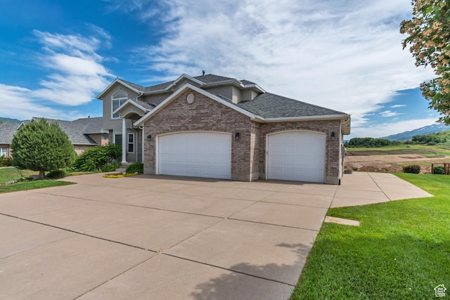 5149 W Rendezvous, Mountain Green, UT 84050 - view of front of house with a garage, a front lawn, driveway, brick siding, and a shingled roof