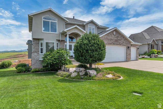 5149 W Rendezvous, Mountain Green, UT 84050 - view of front of home with an attached garage, brick siding, and a front yard