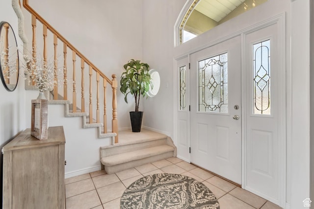 5149 W Rendezvous, Mountain Green, UT 84050 - entryway featuring stairway, tile patterned floors, and a high ceiling