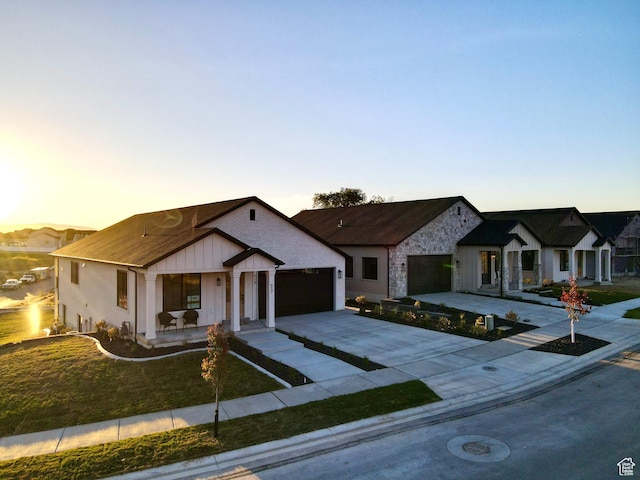 683 N Heritage St, Mapleton, UT 84664 - modern farmhouse style home featuring driveway, a garage, board and batten siding, covered porch, and a front yard