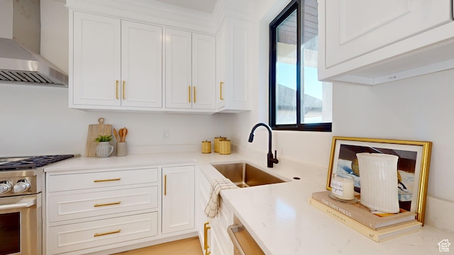 683 N Heritage St, Mapleton, UT 84664 - kitchen with wall chimney exhaust hood, stainless steel gas range, and white cabinetry