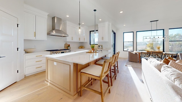 683 N Heritage St, Mapleton, UT 84664 - kitchen featuring wall chimney range hood, light wood-type flooring, light countertops, and recessed lighting