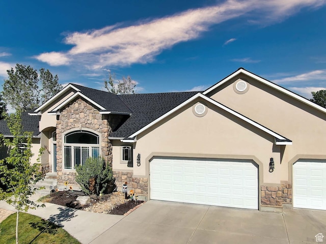 3818 W Alena Cv S, Riverton, UT 84065 - view of front facade with stone siding, stucco siding, concrete driveway, and an attached garage