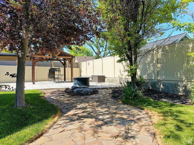 3818 W Alena Cv S, Riverton, UT 84065 - fenced backyard featuring a gazebo and a patio area
