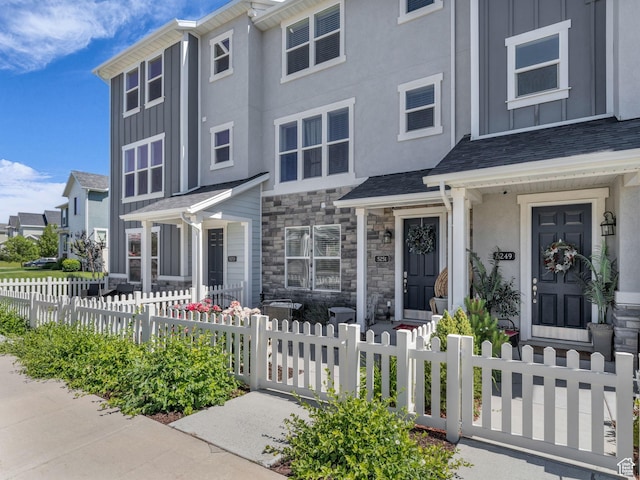 5251 W Linley Ct, Herriman, UT 84096 - multi unit property featuring board and batten siding, stone siding, and a fenced front yard