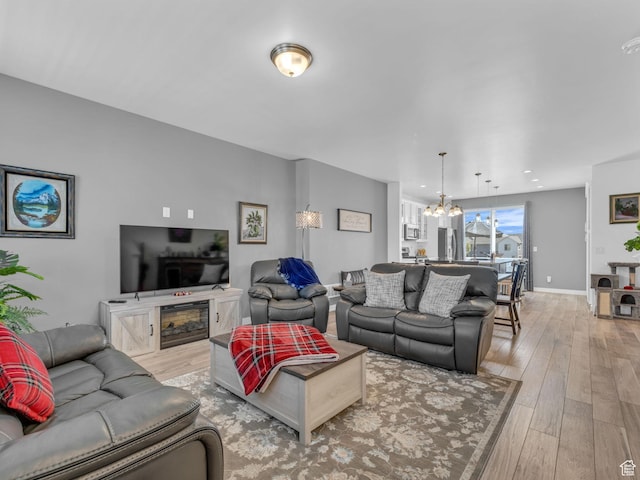 5251 W Linley Ct, Herriman, UT 84096 - living area with light wood-style floors and a chandelier