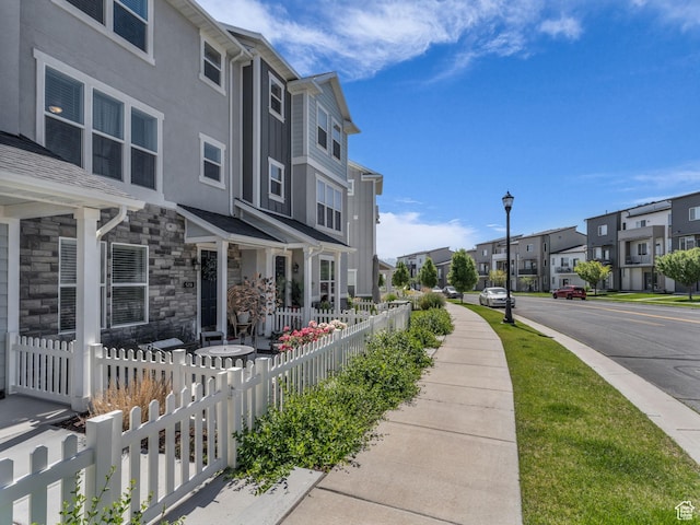 5251 W Linley Ct, Herriman, UT 84096 - view of asphalt street with a residential view, sidewalks, street lighting, and curbs