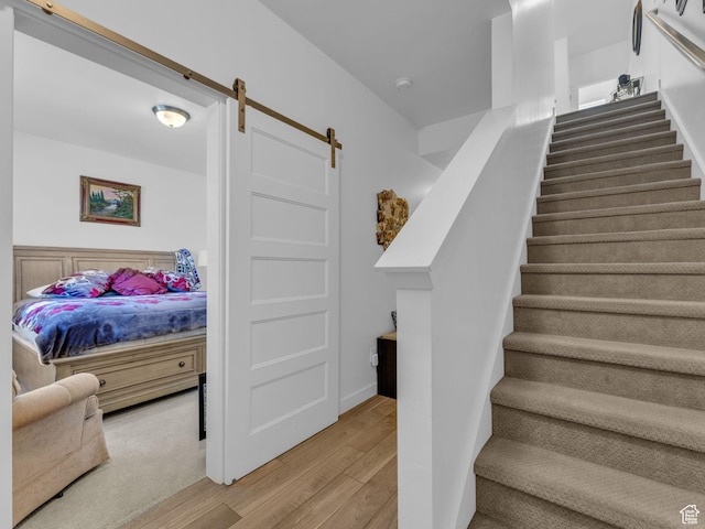 5251 W Linley Ct, Herriman, UT 84096 - staircase with wood finished floors and a barn door