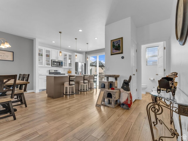 5251 W Linley Ct, Herriman, UT 84096 - living room with light wood-style flooring and recessed lighting