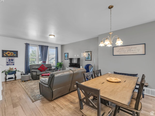 5251 W Linley Ct, Herriman, UT 84096 - dining area with light wood finished floors and a chandelier
