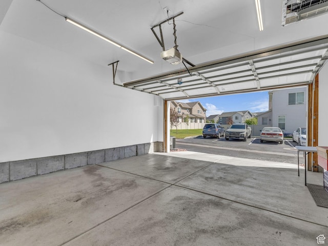 5251 W Linley Ct, Herriman, UT 84096 - garage featuring a garage door opener and a residential view