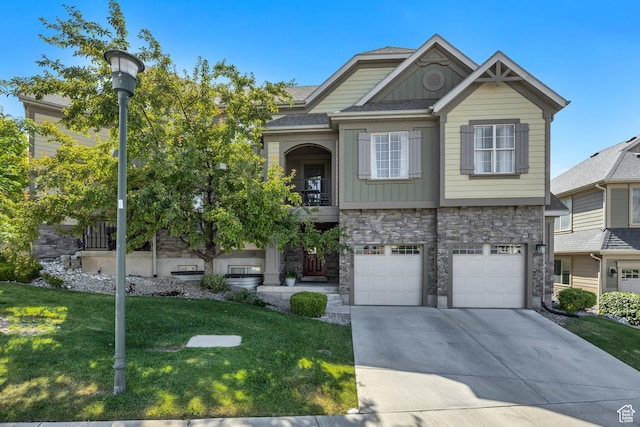 9209 N Prairie Dunes Way, Eagle Mountain, UT 84005 - craftsman house with stone siding, a balcony, a front yard, driveway, and an attached garage