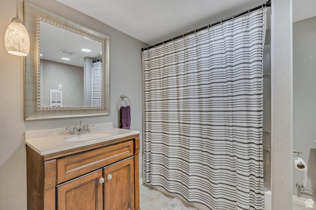 9209 N Prairie Dunes Way, Eagle Mountain, UT 84005 - bathroom featuring vanity, shower / tub combo with curtain, and tile patterned floors