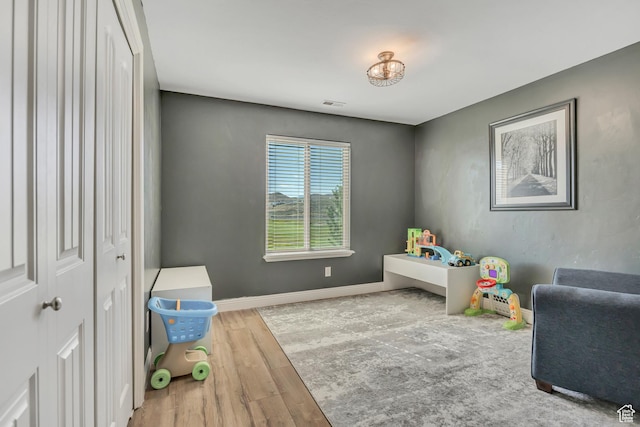 9209 N Prairie Dunes Way, Eagle Mountain, UT 84005 - recreation room featuring wood finished floors and baseboards