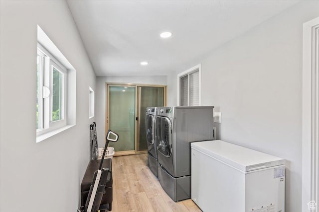 1543 E Spring Run Dr, Salt Lake City, UT 84117 - washroom featuring washing machine and clothes dryer, light wood-style flooring, and recessed lighting