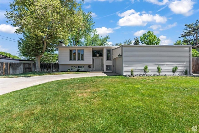 1543 E Spring Run Dr, Salt Lake City, UT 84117 - bi-level home featuring driveway, a garage, and a chimney