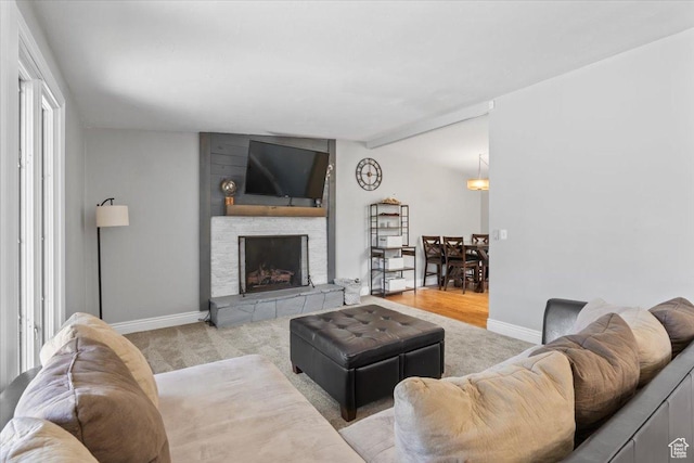 1543 E Spring Run Dr, Salt Lake City, UT 84117 - carpeted living room with baseboards and a stone fireplace