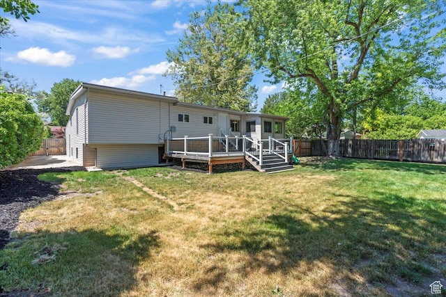 1543 E Spring Run Dr, Salt Lake City, UT 84117 - rear view of house with a fenced backyard and a deck
