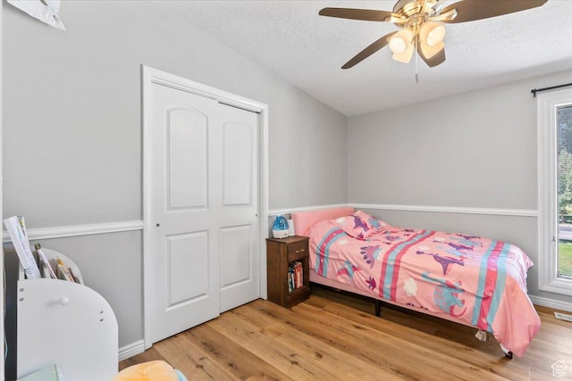 1543 E Spring Run Dr, Salt Lake City, UT 84117 - bedroom with wood finished floors, a textured ceiling, and ceiling fan