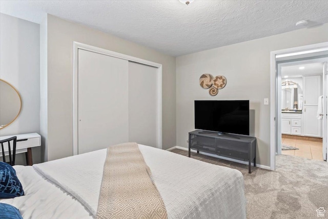 1543 E Spring Run Dr, Salt Lake City, UT 84117 - carpeted bedroom with a closet and a textured ceiling
