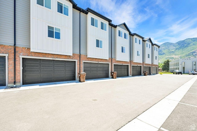 1281 16th St Unit 1281, Ogden, UT 84404 - view of property with a mountain view, a garage, and a residential view
