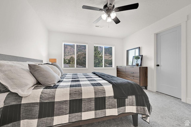 1281 16th St Unit 1281, Ogden, UT 84404 - bedroom featuring light colored carpet, a ceiling fan, and a textured ceiling