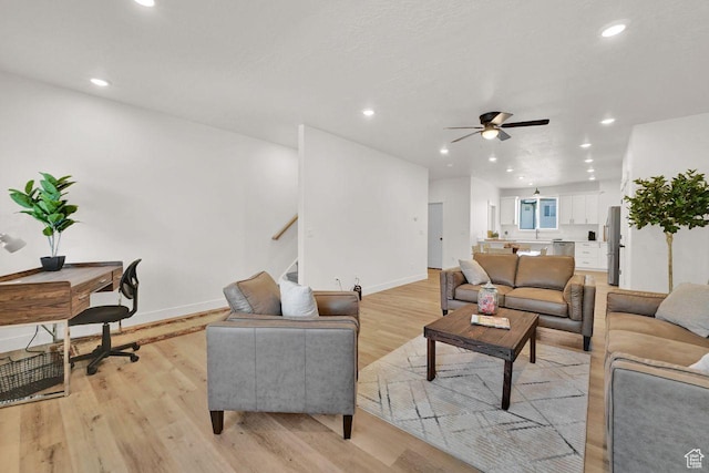 1281 16th St Unit 1281, Ogden, UT 84404 - living room with light wood-type flooring, ceiling fan, recessed lighting, and stairs