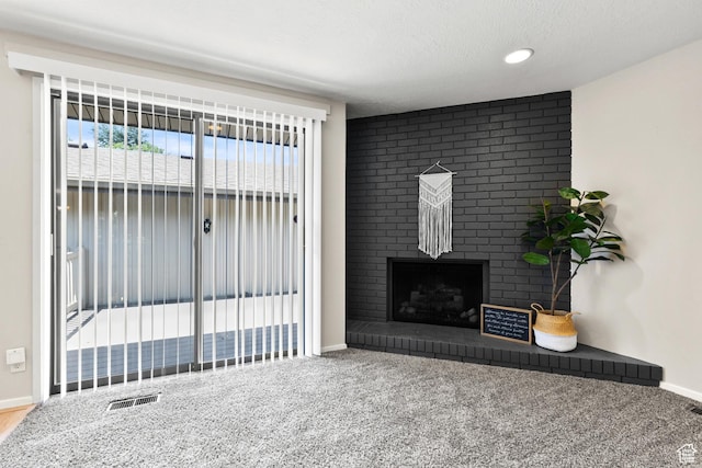 2522 E 1950 N, Layton, UT 84040 - living area featuring a fireplace, carpet flooring, and a textured ceiling