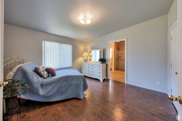 466 W Wingate Ave, Moab, UT 84532 - bedroom with wood finished floors, lofted ceiling, and connected bathroom
