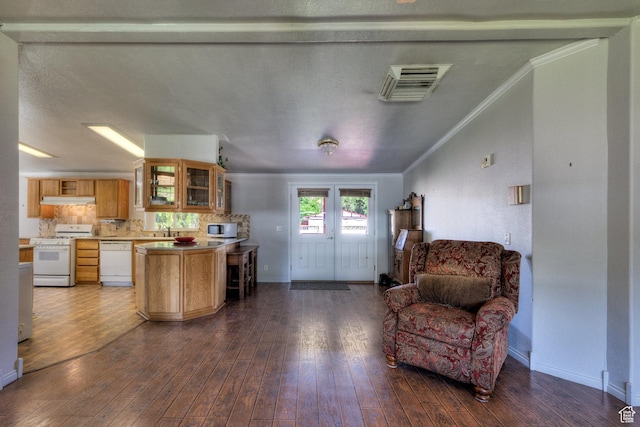 466 W Wingate Ave, Moab, UT 84532 - kitchen featuring white appliances, ornamental molding, open floor plan, light countertops, and glass insert cabinets