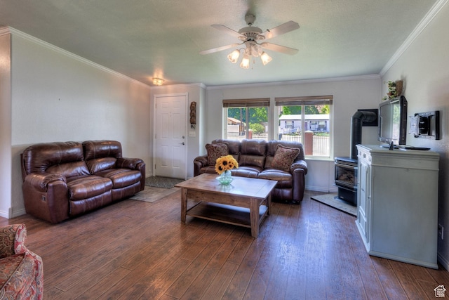 466 W Wingate Ave, Moab, UT 84532 - living room featuring a wood stove, a ceiling fan, wood finished floors, and ornamental molding