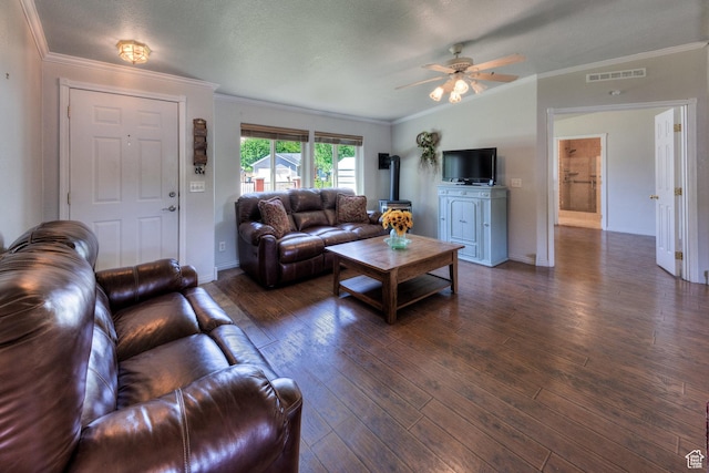 466 W Wingate Ave, Moab, UT 84532 - living area with dark wood-style floors, ornamental molding, ceiling fan, and a wood stove