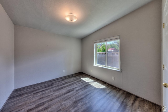 466 W Wingate Ave, Moab, UT 84532 - spare room featuring dark wood finished floors and lofted ceiling