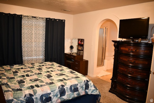 148 Walton Ct, North Salt Lake, UT 84054 - carpeted bedroom featuring arched walkways and a textured ceiling