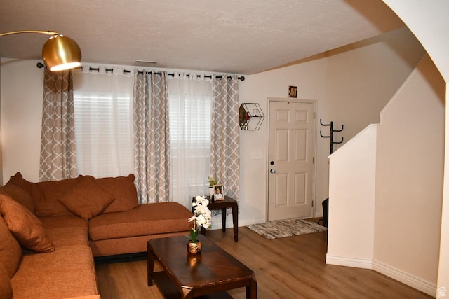 148 Walton Ct, North Salt Lake, UT 84054 - living area with wood finished floors and a textured ceiling