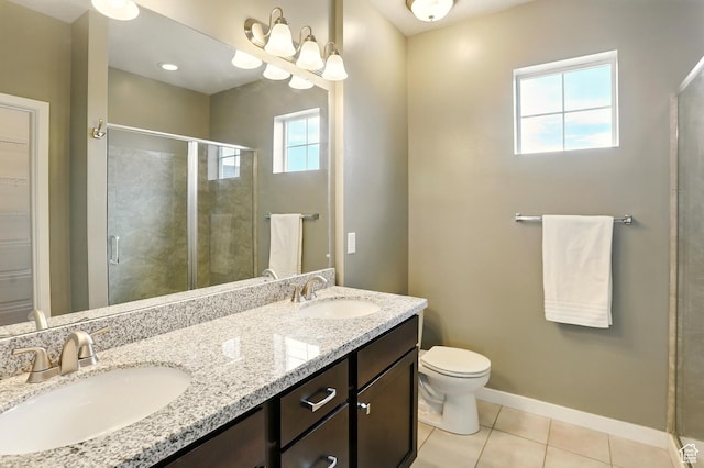5254 W Burntside Ave, South Jordan, UT 84009 - bathroom featuring healthy amount of natural light, a shower stall, tile patterned floors, and double vanity