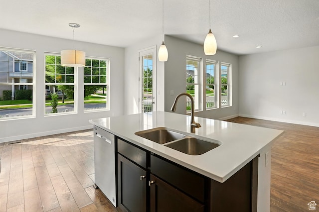 5254 W Burntside Ave, South Jordan, UT 84009 - kitchen featuring dishwasher, healthy amount of natural light, wood finished floors, a textured ceiling, and recessed lighting