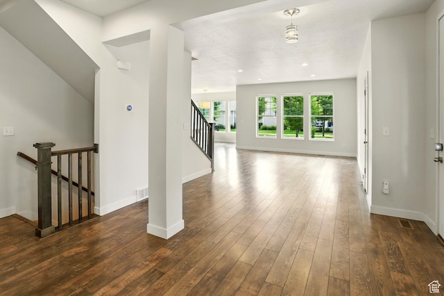 5254 W Burntside Ave, South Jordan, UT 84009 - unfurnished living room with dark wood-style floors, stairs, and recessed lighting