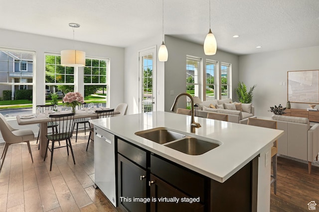 5254 W Burntside Ave, South Jordan, UT 84009 - kitchen with stainless steel dishwasher, healthy amount of natural light, open floor plan, a textured ceiling, and recessed lighting