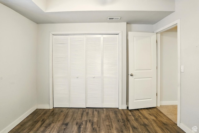 5254 W Burntside Ave, South Jordan, UT 84009 - unfurnished bedroom featuring dark wood-type flooring and a closet