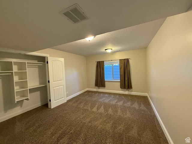 420 N Josephine Ln, Price, UT 84501 - unfurnished bedroom with dark carpet and a textured ceiling