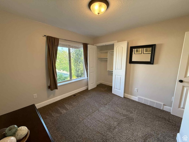 420 N Josephine Ln, Price, UT 84501 - unfurnished bedroom with dark colored carpet and a closet
