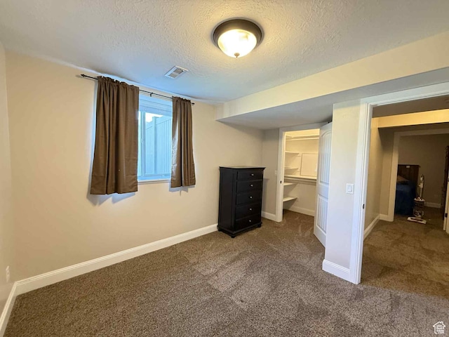 420 N Josephine Ln, Price, UT 84501 - unfurnished bedroom with a textured ceiling and carpet flooring